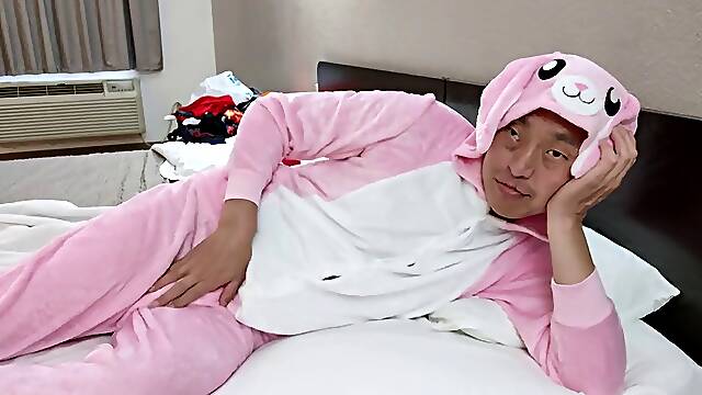 Hot Asian posing in my new pink jumpsuit and black zip up boxer briefs in a cheap motel