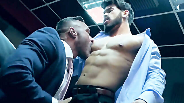 Elegant hunk wears slick blue suit while ramming hot stud