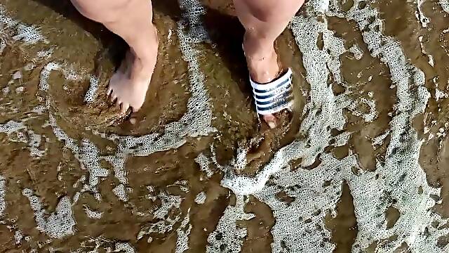 Feet and the sea additional slowmotion - one foot barefoot and foot in slip - great feet in sea