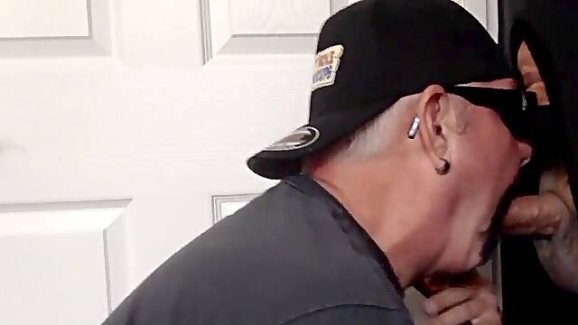 Mature faggot closeup fellates and jerks hard-on through gloryhole