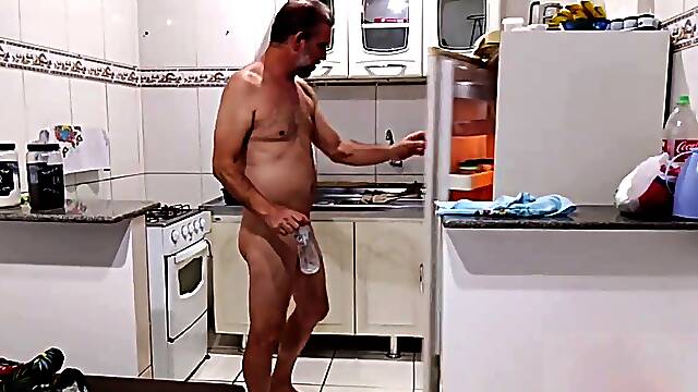 Naked mummy alone in the kitchen