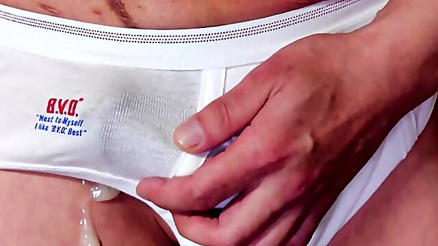 Squeeze your dick from the top of your white briefs and ejaculate as it is