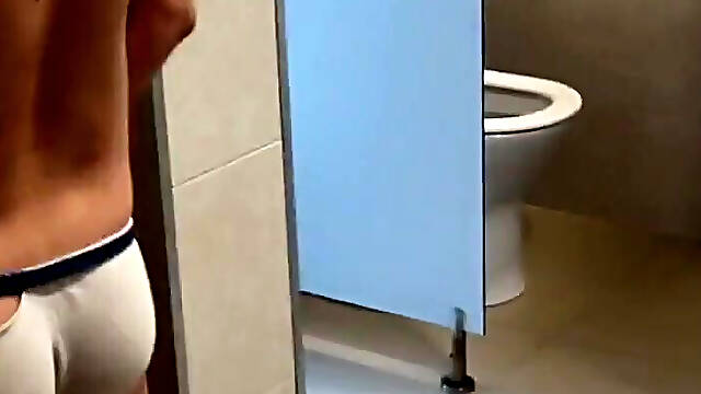 2 Boys Having Fun at the Pool Public Toilets Urinal
