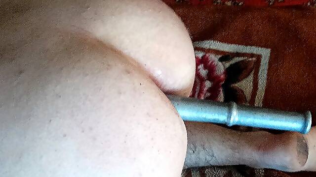 Passive slut slaps herself with a belt on the ass and fucks Anal with a 27 cm Phallus